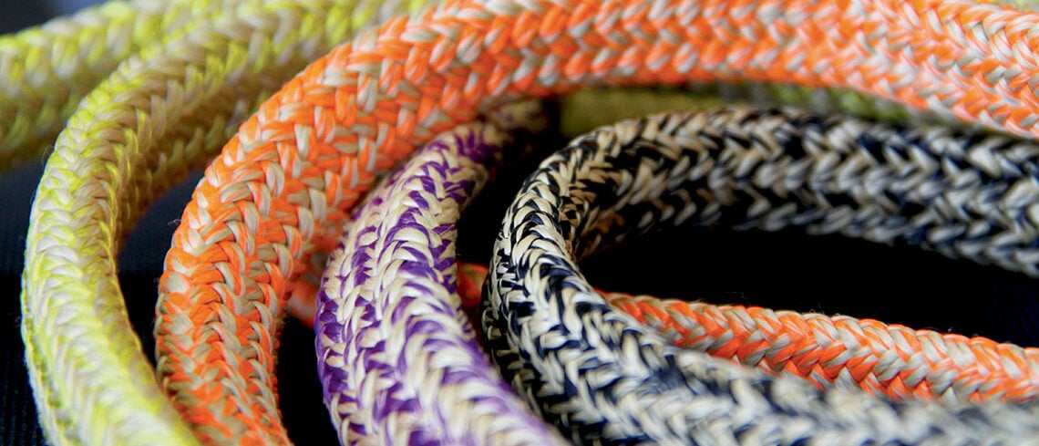 Coils of braided ropes in different colours and fibres