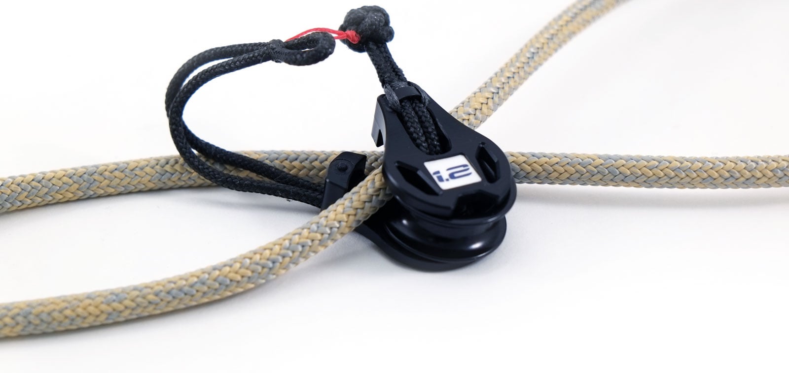 Snatch block on a grey and yellow rope