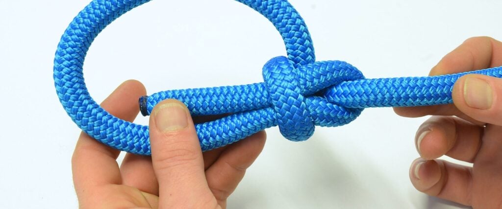 Tying a bowline knot on a blue double-braid rope
